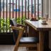 Triple E Hotel Fine Art Museum in Ho Chi Minh City, seating by a window with city rooftop view