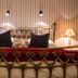 Country House Duinhof in De Haan bedroom with brass bed, striped wallpaper and bedside lamps