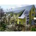 Pension Wave Inn in Itō, bright yellow guesthouse exterior with garden and hillside view