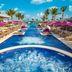 Planet Hollywood Adult Scene Cancun pool with cabanas, loungers and palm trees in Cancún