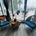 Lyfe Resort And Residences, Hollywood: lounge chairs by floor-to-ceiling windows with pool deck and ocean view