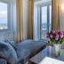 Santiago de Alfama - Boutique Hotel, Lisbon room with sea view, balcony doors, and flower vase