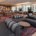 Courtyard by Marriott Fairfax Fair Oaks lounge with bar seating and dining area in Fairfax