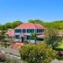 Weatherills Hotel in Cedar Grove with red-roofed colonial-style buildings and landscaped gardens