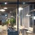 Pohang Youngildae Guesthouse dining area with white tables, chairs, pendant lights and potted plants