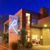 Fitzherbert Regency Motor Lodge in Palmerston North exterior at dusk with illuminated entry