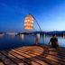 Grand Hôtel De Cala Rossa in Porto-Vecchio, waterfront dock with a lantern at dusk