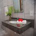Pousada Velha Boipeba bathroom with granite sink, toilet, tiled walls and a vanity mirror