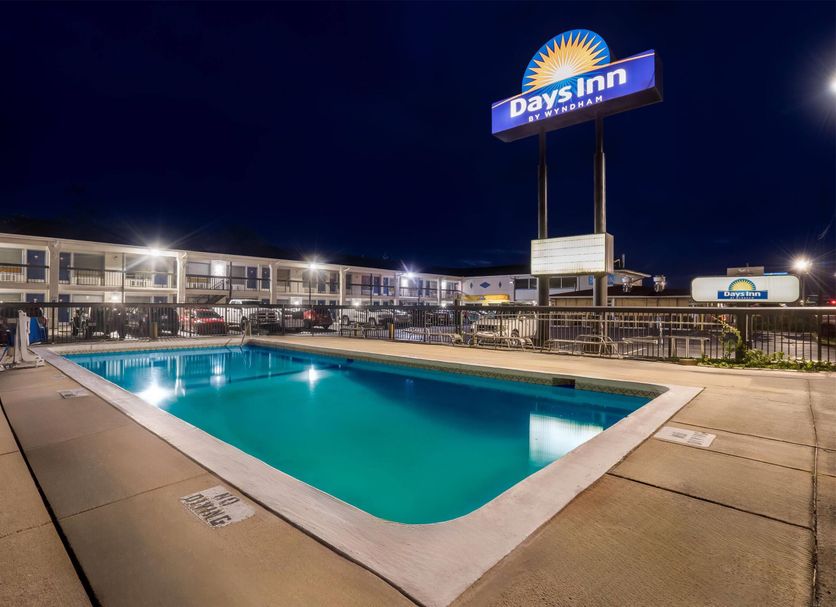 Days Inn by Wyndham Jacksonville NC outdoor pool at night in Jacksonville
