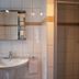 Salzufler Hof Bad Salzuflen bathroom with sink, mirror, towel rack and glass shower stall