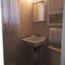 Evening Shade River Lodge & Cabins bathroom in Chimney Rock with pedestal sink, mirror, and shower curtain