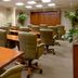 Oakwood Falls Church meeting room with long conference tables and rolling chairs