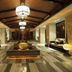 Wuxi Idea Garden Hotel lobby in Wuxi with central fountain, pendant lights, and lounge seating