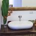 Otro Lado Lodge And Restaurant, Santa Teresa: bathroom sink with wooden vanity, mirror, towels and toiletries