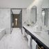 Address Jabal Omar Makkah bathroom with freestanding tub, double vanity and marble finishes in Mecca