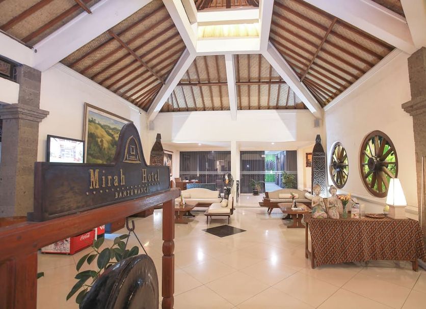 Mirah Hotel & Resort Banyuwangi lobby with vaulted wooden ceiling and seating area