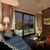 Anatole Hotel Hanoi in Hanoi: suite with balcony, city view, sofa seating and bedroom area