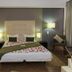 Hotel Santiago, Praia: modern guest room with king bed, bedside lamps, wardrobe and chair