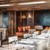 Jiva Hill Resort - Genève restaurant with set dining tables and cozy lounge seating in Crozet