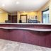 Days Inn by Wyndham Maumee/Toledo lobby with front desk and seating area in Maumee