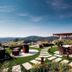 Genusshotel Riegersburg in Riegersburg with a terrace, seating, and panoramic hill views