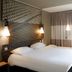 ibis Paris Saint-Denis Stade Sud room with double bed, pendant lights and window in La Plaine-Saint-Denis