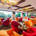 Grand Bayview Hotel Ningbo lounge with colorful armchairs and large windows overlooking greenery