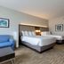 Holiday Inn Express & Suites Onalaska - La Crosse Area guest room with two queen beds and sofa