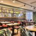 Premier Inn Glasgow - Cambuslang/M74 J2a dining area with round tables, tropical chairs and large windows