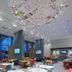 ibis Konya lobby with floor-to-ceiling windows, colorful seating, and ceiling art in Konya