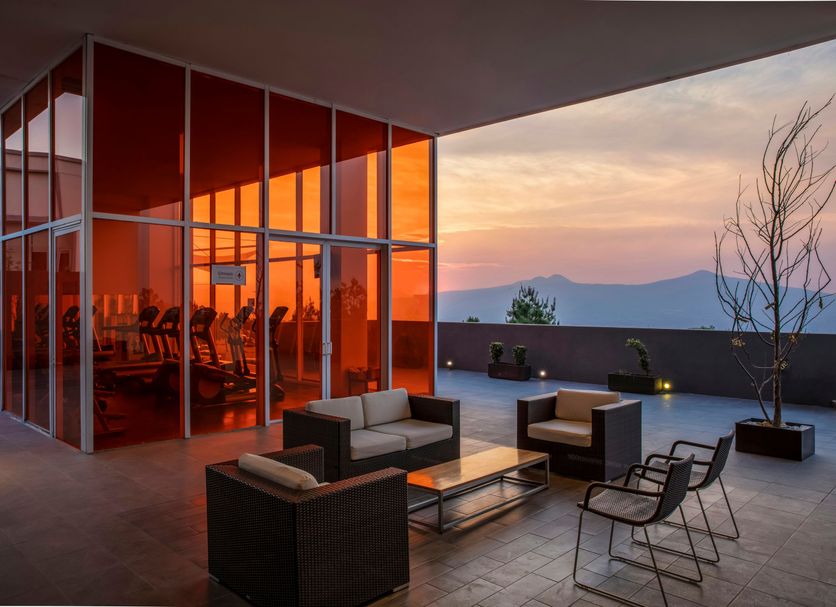 Fiesta Inn Morelia Altozano terrace lounge with sunset mountain view in Morelia