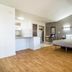 Studio 6-Plano, TX - Dallas - Plano Medical Center room with king bed, kitchenette and wood floors