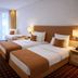 City Hotel Isar-Residenz in Landshut: twin guest room with two beds, desk, and balcony doors