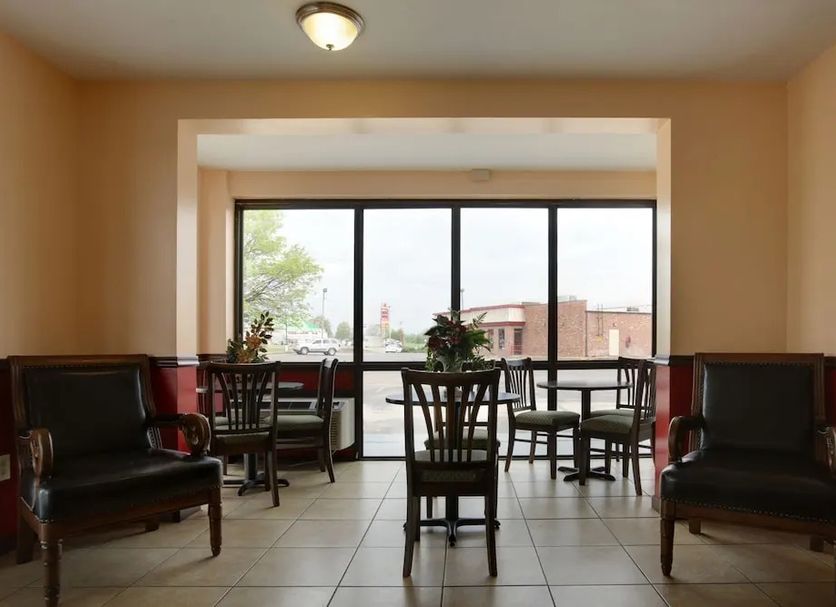 Americas Best Value Inn & Suites Senatobia lobby seating area with large windows and outdoor view