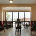 Americas Best Value Inn & Suites Senatobia lobby seating area with large windows and outdoor view
