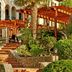 Sheraton Mallorca Arabella Golf Hotel in Palma de Mallorca, terraced garden steps with pergolas and palm trees