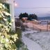 Hosteria Las Amapolas in San Carlos de Bariloche with snowy roadside view and lit exterior