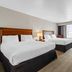 Country Inn & Suites by Radisson Chambersburg, PA room with two queen beds and window seating