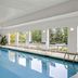 Residence Inn by Marriott Chicago Naperville/Warrenville indoor pool in Warrenville with large windows and lounge chairs