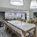 Homewood Suites by Hilton Bonita Springs Naples North lounge with seating and pool view
