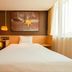 Iu Hotel Tianjin Xianshuigu National Exhibition Center Yuntan University Town room with bed, desk, and large window