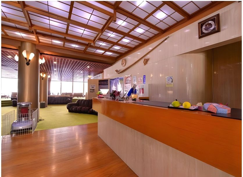 Nikko Yumoto Onsen Honokana Yado Jurin lobby reception with wood ceiling and seating in Nikkō
