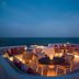 Four Seasons Resort Cabo Del Sol in Cabo San Lucas rooftop terrace with ocean view and lounge seating at dusk