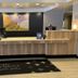 Spark by Hilton Erie lobby reception desk with modern front desk and welcome mat