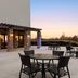 Holiday Inn Express & Suites Lexington NW-The Vineyard patio with tables, stone columns and sunset view