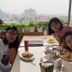 Guests dining at Sierra Homestay in Ninh Binh with misty mountain views from the terrace.