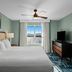 WorldMark Lake of the Ozarks room with king bed, lake view, ceiling fan and TV in Osage Beach