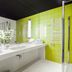 Hotel Metropolitan Rzeszow bathroom with lime green tile shower, double sink vanity and modern mirror
