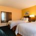 Fairfield Inn by Marriott Orangeburg guest room with two double beds and bedside lamp