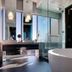 Hard Rock Hotel & Casino Biloxi bathroom with soaking tub, glass shower and ocean-view window in Biloxi